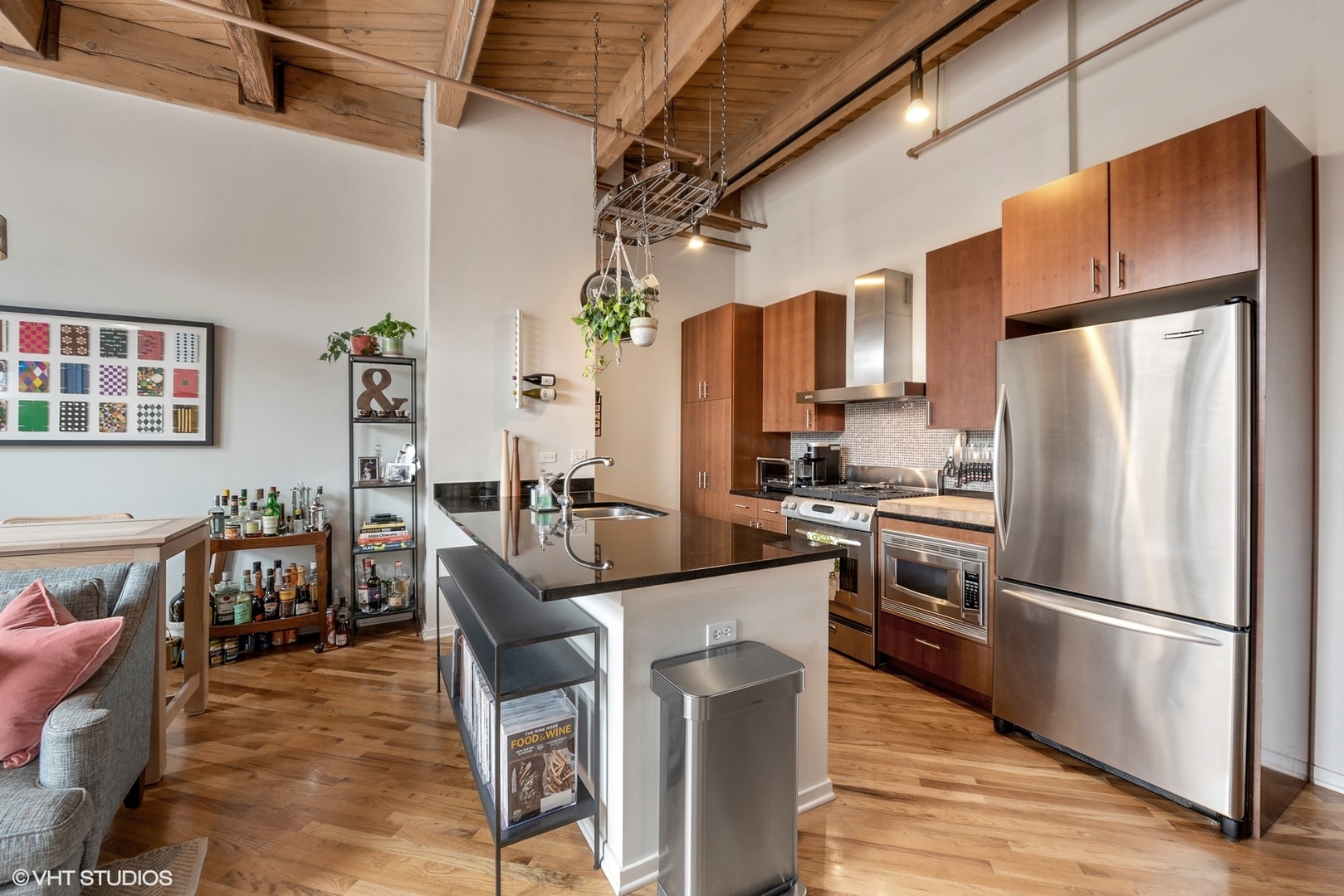 1040 West Adams Street, Unit 428 Chicago, IL 60607 - Photo 17 of 28 a kitchen with stainless steel appliances a refrigerator a stove a dining table and chairs