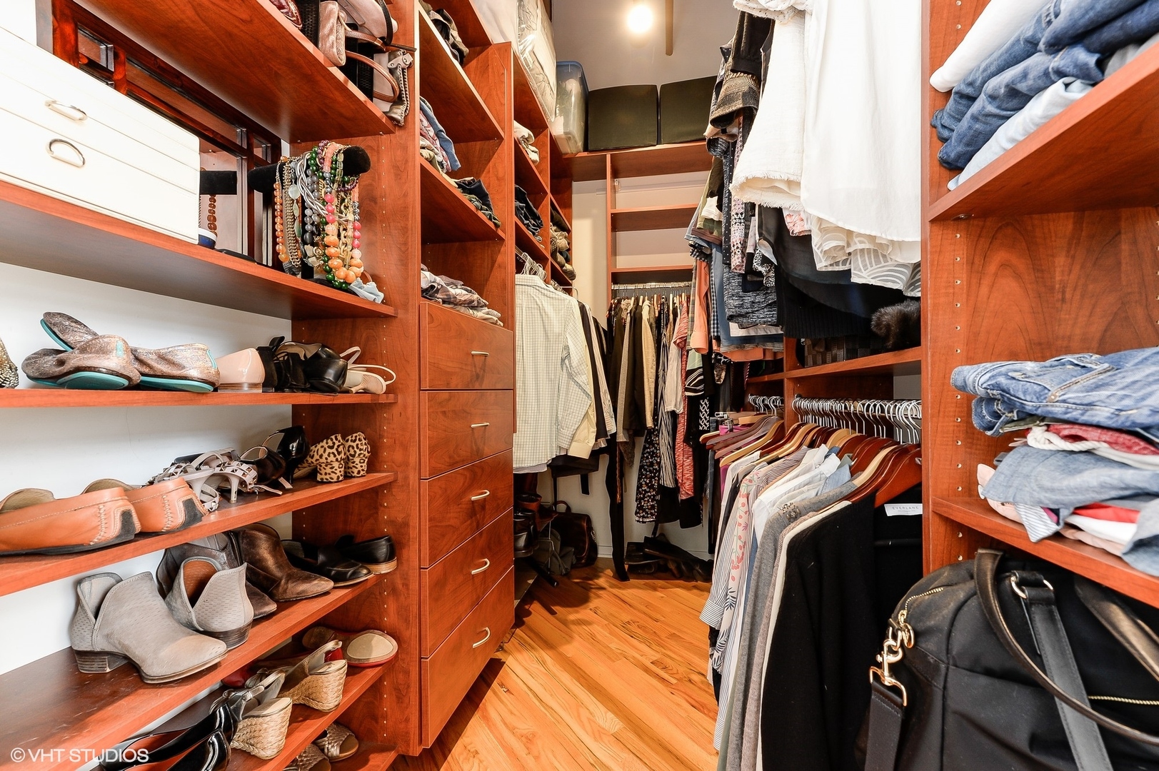 1040 West Adams Street, Unit 428 Chicago, IL 60607 - Photo 19 of 28 a view of walk in closet with clothes and shoes