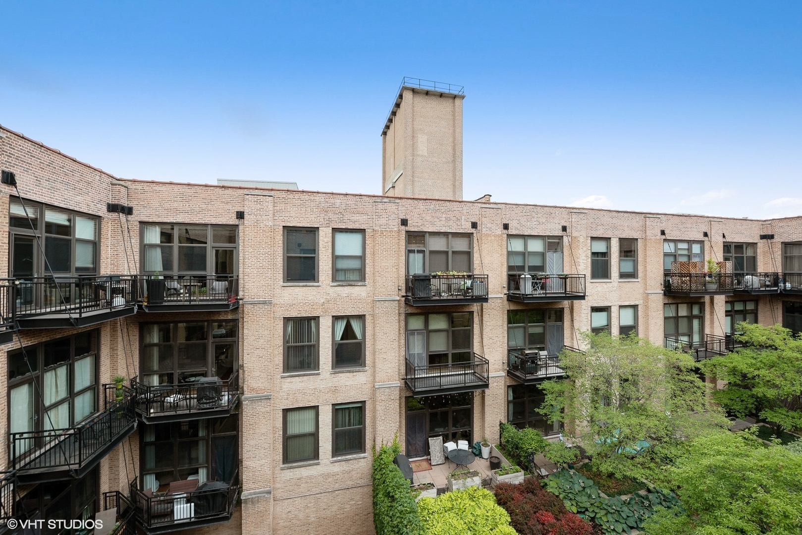1040 West Adams Street, Unit 428 Chicago, IL 60607 - Photo 27 of 28 a front view of a building with glass windows