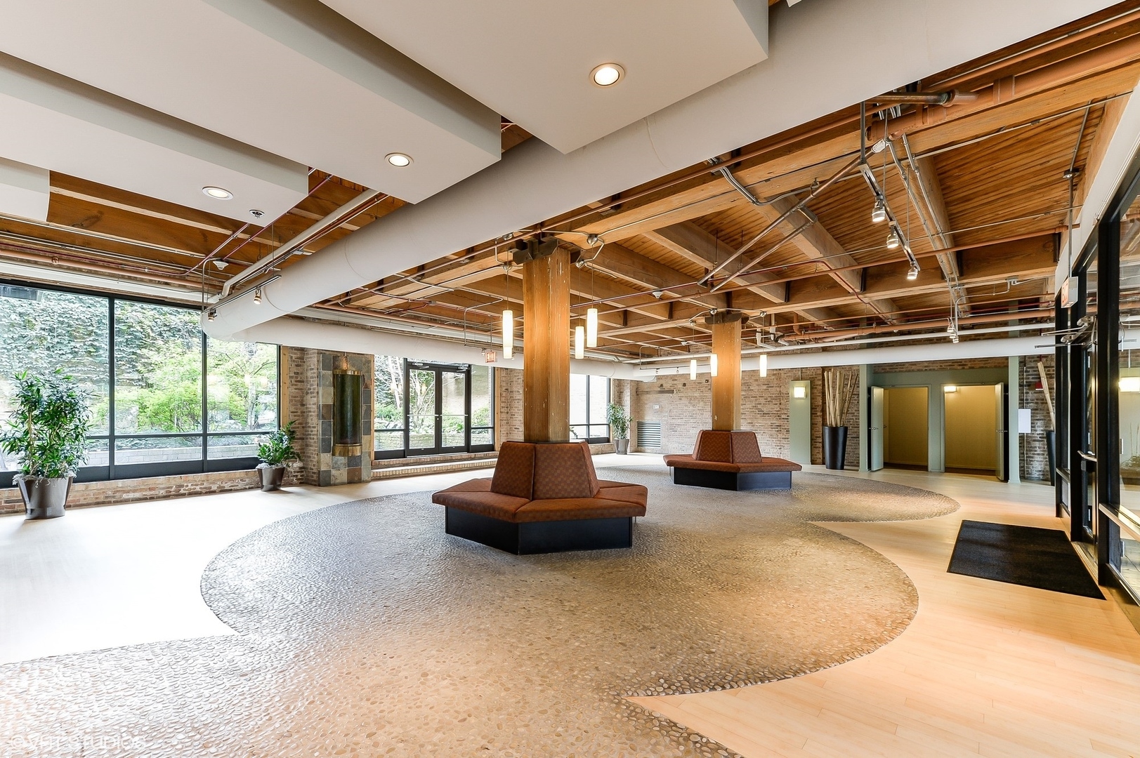 1040 West Adams Street, Unit 428 Chicago, IL 60607 - Photo 4 of 28 a lobby with furniture and large windows