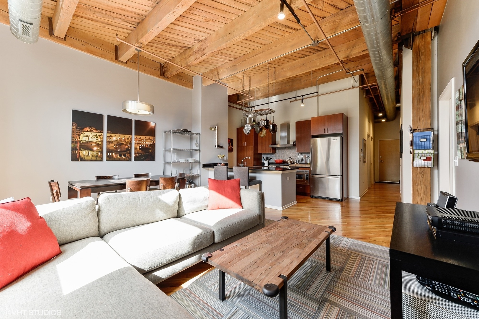 1040 West Adams Street, Unit 428 Chicago, IL 60607 - Photo 9 of 28 a living room with furniture and a flat screen tv