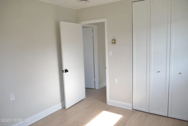 a view of a hallway with closet area