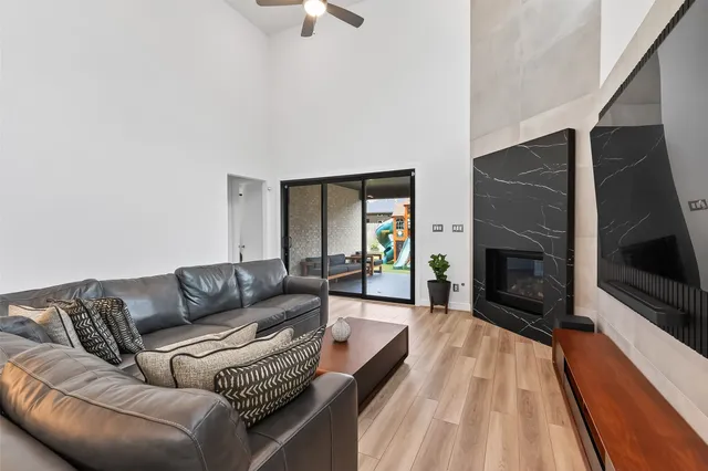 a kitchen with kitchen island granite countertop a sink a counter top space appliances and cabinets