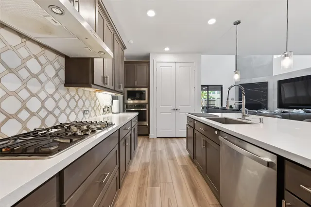 a view of empty room with wooden floor and windows