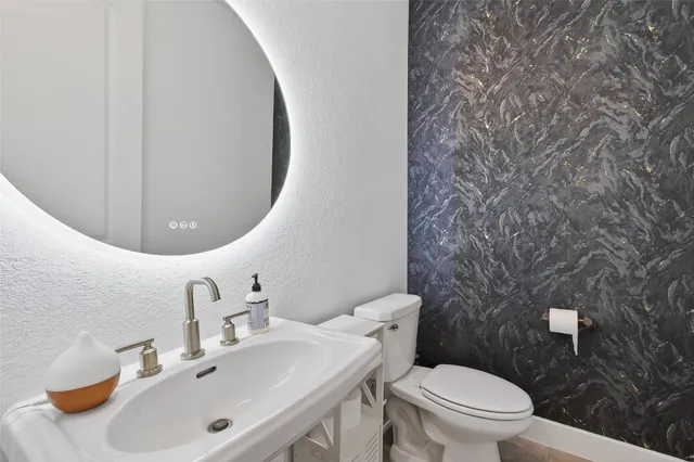 a bedroom with a bed and cabinets