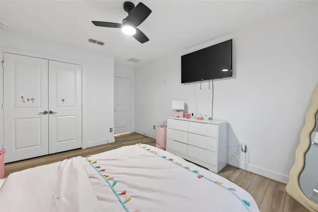 a spacious bathroom with a double vanity sink a large mirror and a shower