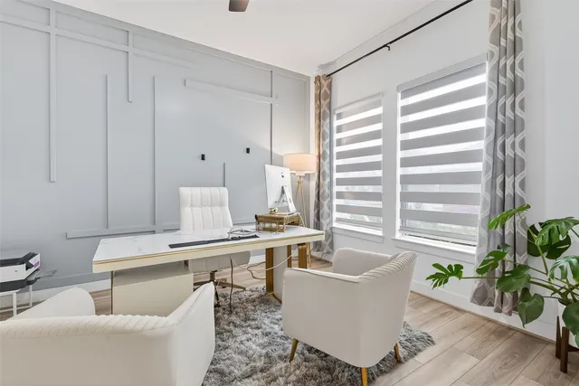 a view of an entryway with wooden floor and staircase