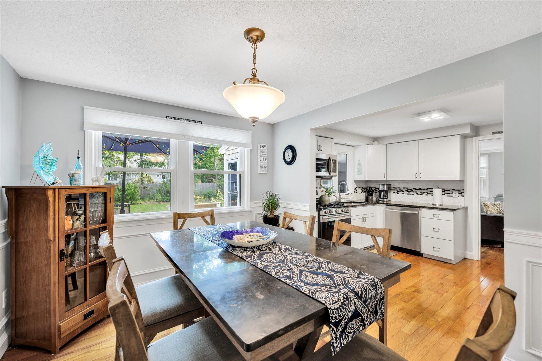 30 Guildford Road Centerville, MA 02632 - Photo 18 of 42 a view of a dining room with furniture window and wooden floor