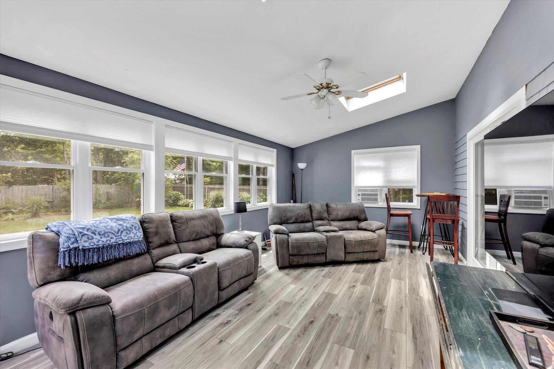 30 Guildford Road Centerville, MA 02632 - Photo 21 of 42 a living room with furniture and a large window