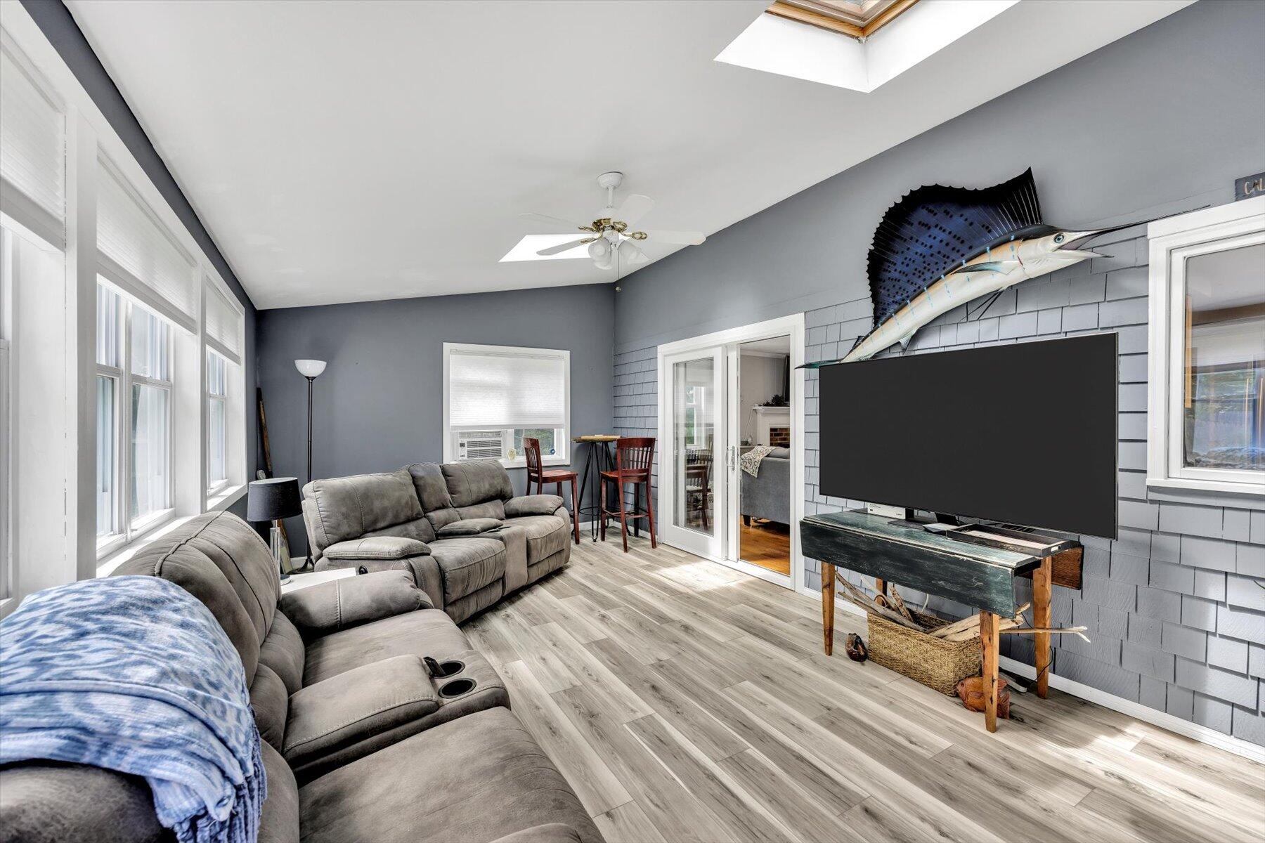 30 Guildford Road Centerville, MA 02632 - Photo 23 of 42 a living room with furniture and a flat screen tv