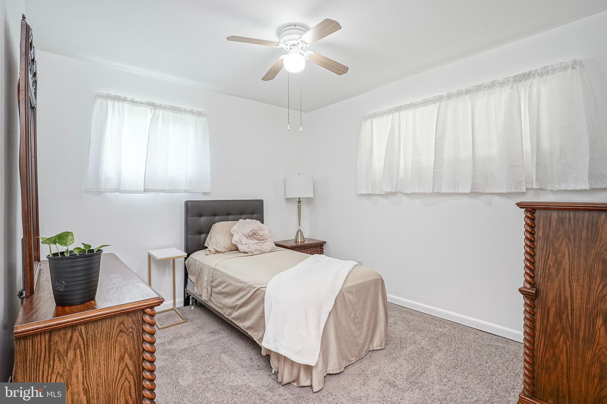 419 Ruth Avenue Maple Shade, NJ 08052 - Photo 18 of 28 a bedroom with a bed and a potted plant
