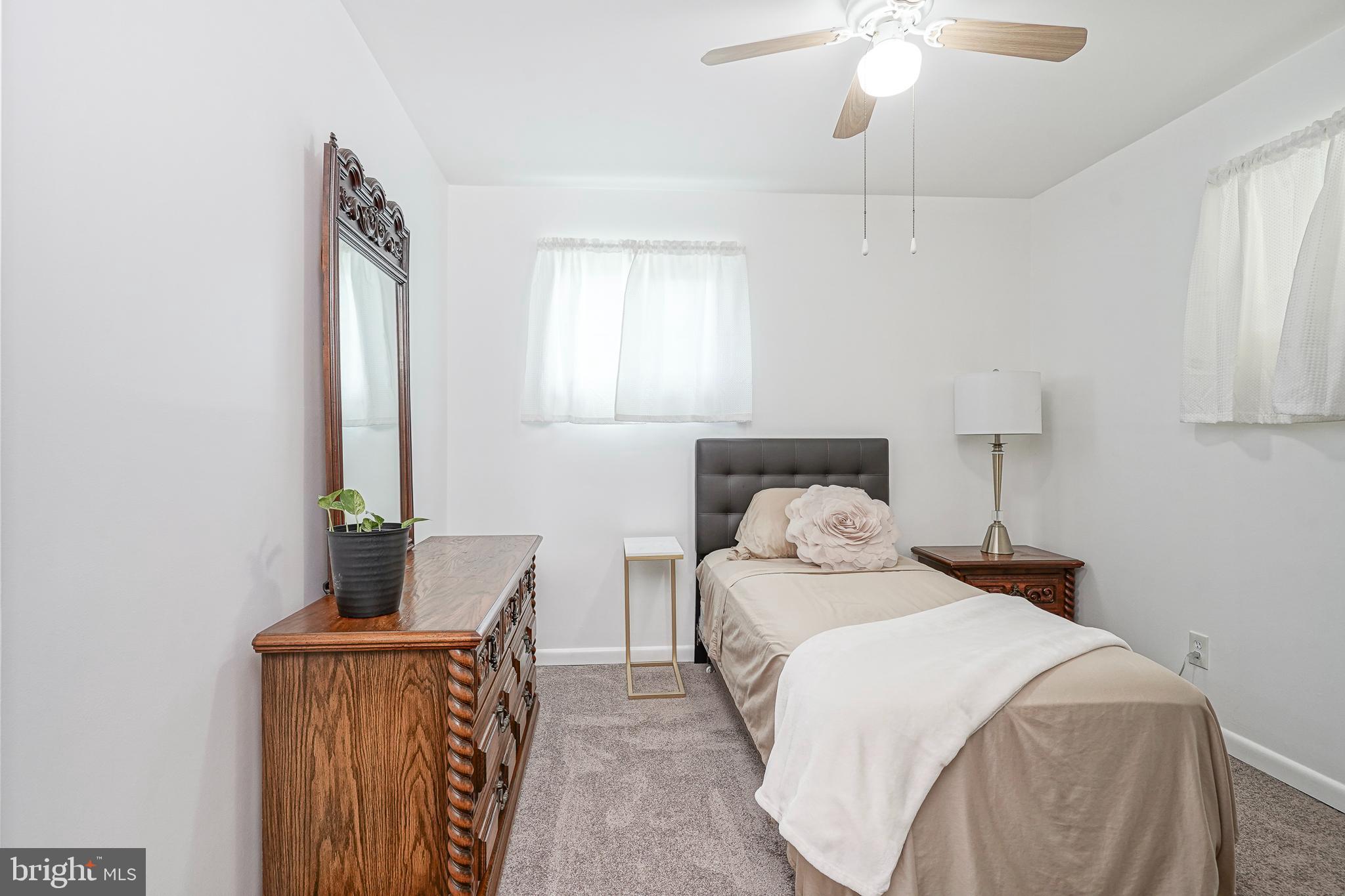 419 Ruth Avenue Maple Shade, NJ 08052 - Photo 19 of 28 a bedroom with a bed and window
