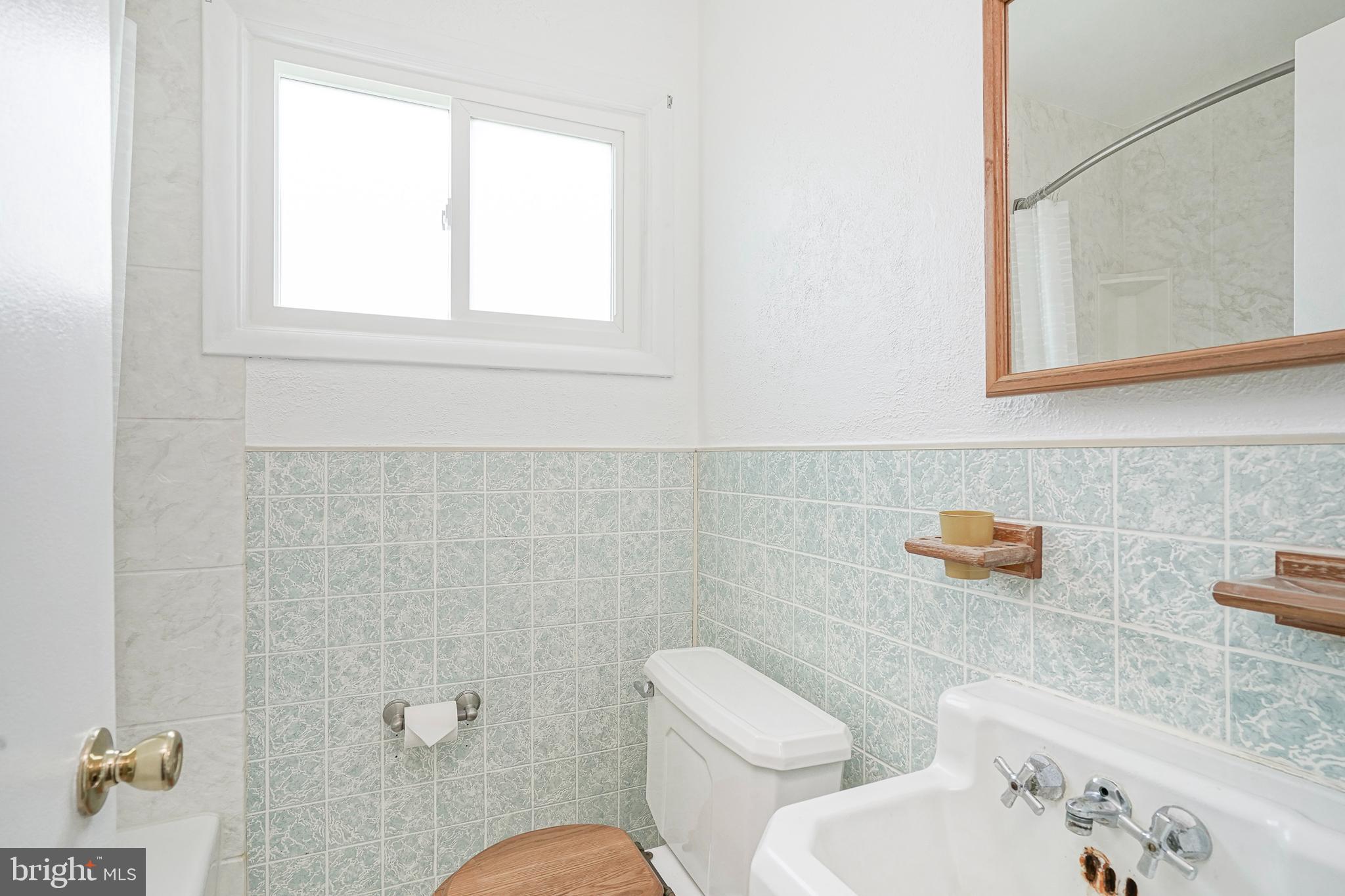 419 Ruth Avenue Maple Shade, NJ 08052 - Photo 20 of 28 a bathroom with a toilet sink and mirror