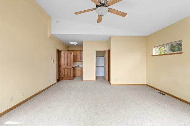 a bathroom with a toilet sink and shower