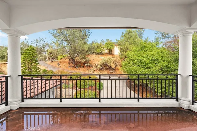 an aerial view of residential building with green space