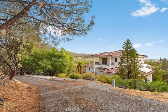 a view of a living room with a floor to ceiling window and pool