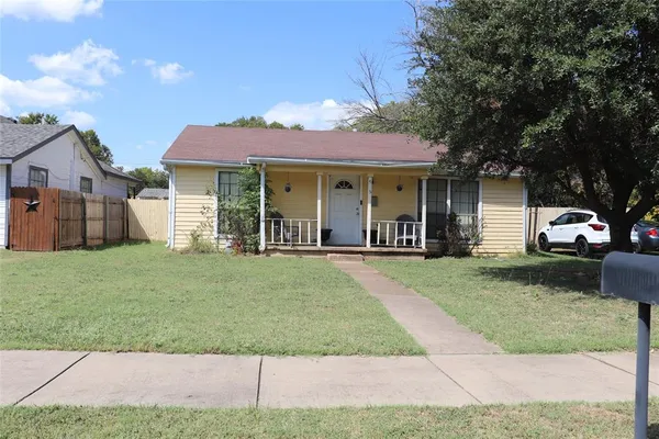 front view of a house with a yard