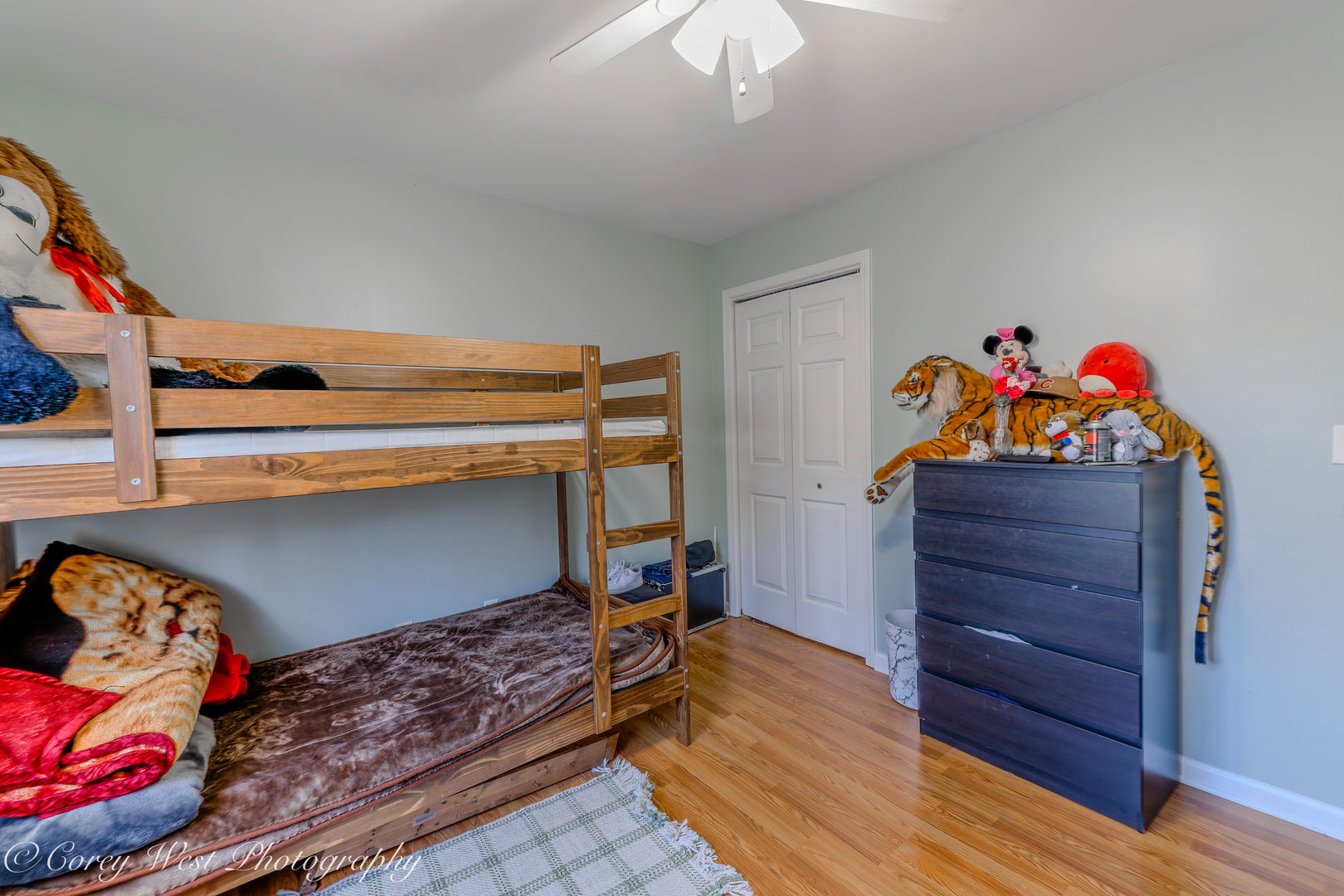 607 North 9th Street DeKalb, IL 60115 - Photo 7 of 14 a bed room with a bed and a dresser