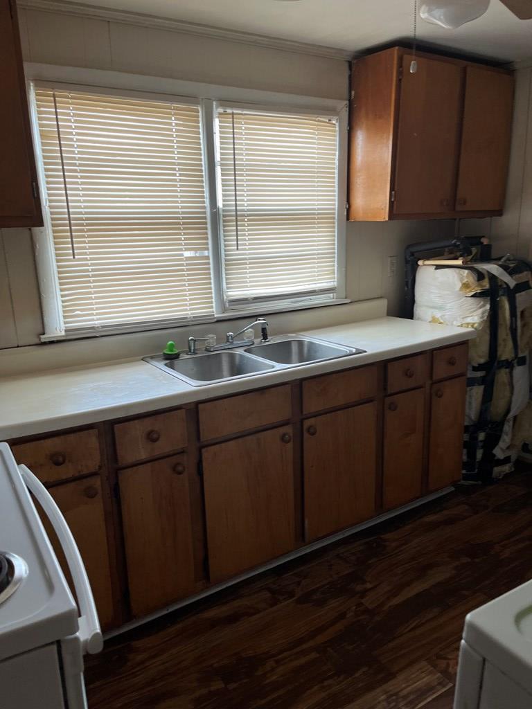 200 Hunt Circle, Unit 200 Manchester, GA 31816 - Photo 4 of 14 a kitchen with a sink a window and cabinets