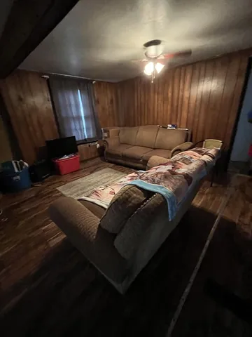 a bed sitting in a room next to a room