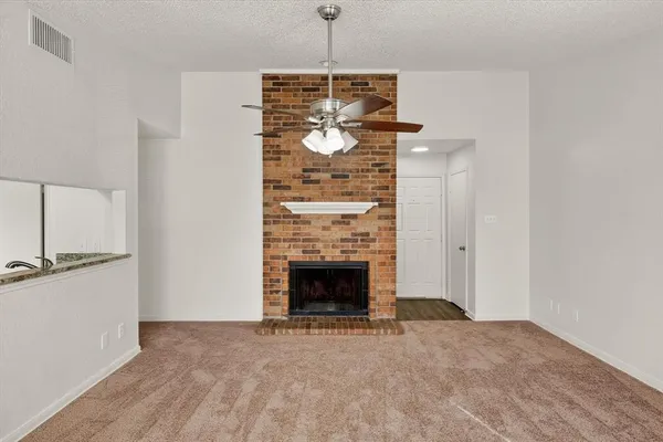 a kitchen with a sink a stove and cabinets