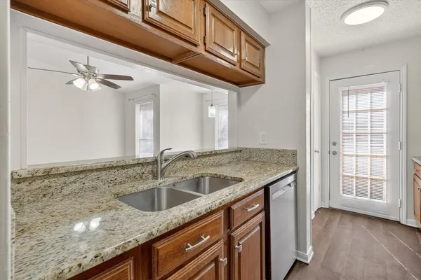 a kitchen with a stove microwave and sink