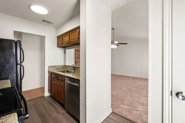 a kitchen with granite countertop a sink and a granite counter tops