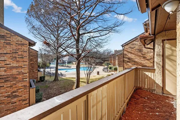 a view of balcony with wooden floor