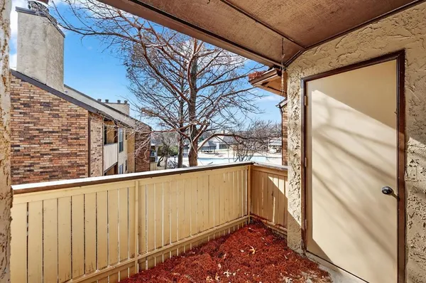 a bathroom with a shower and mirror