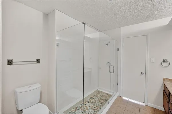 a bathroom with a shower and a sink