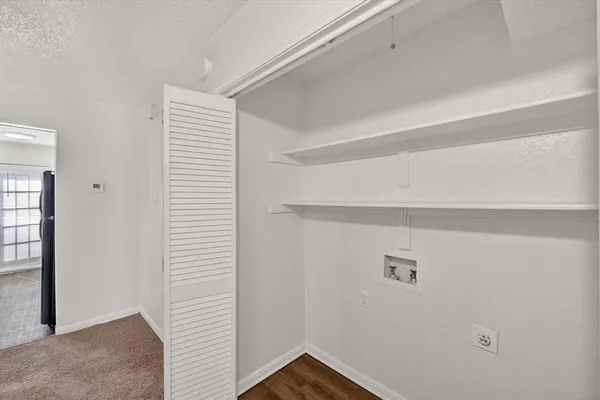 a bathroom with a granite countertop sink a toilet and bathtub