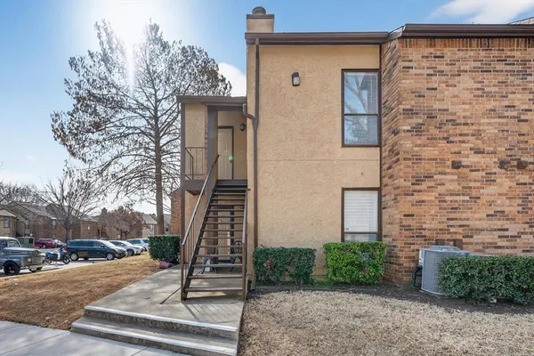 a front view of a house with stairs