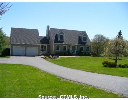 2 Burgess Road Morris, CT 06763 - Photo 1 of 1 a front view of a house with a yard