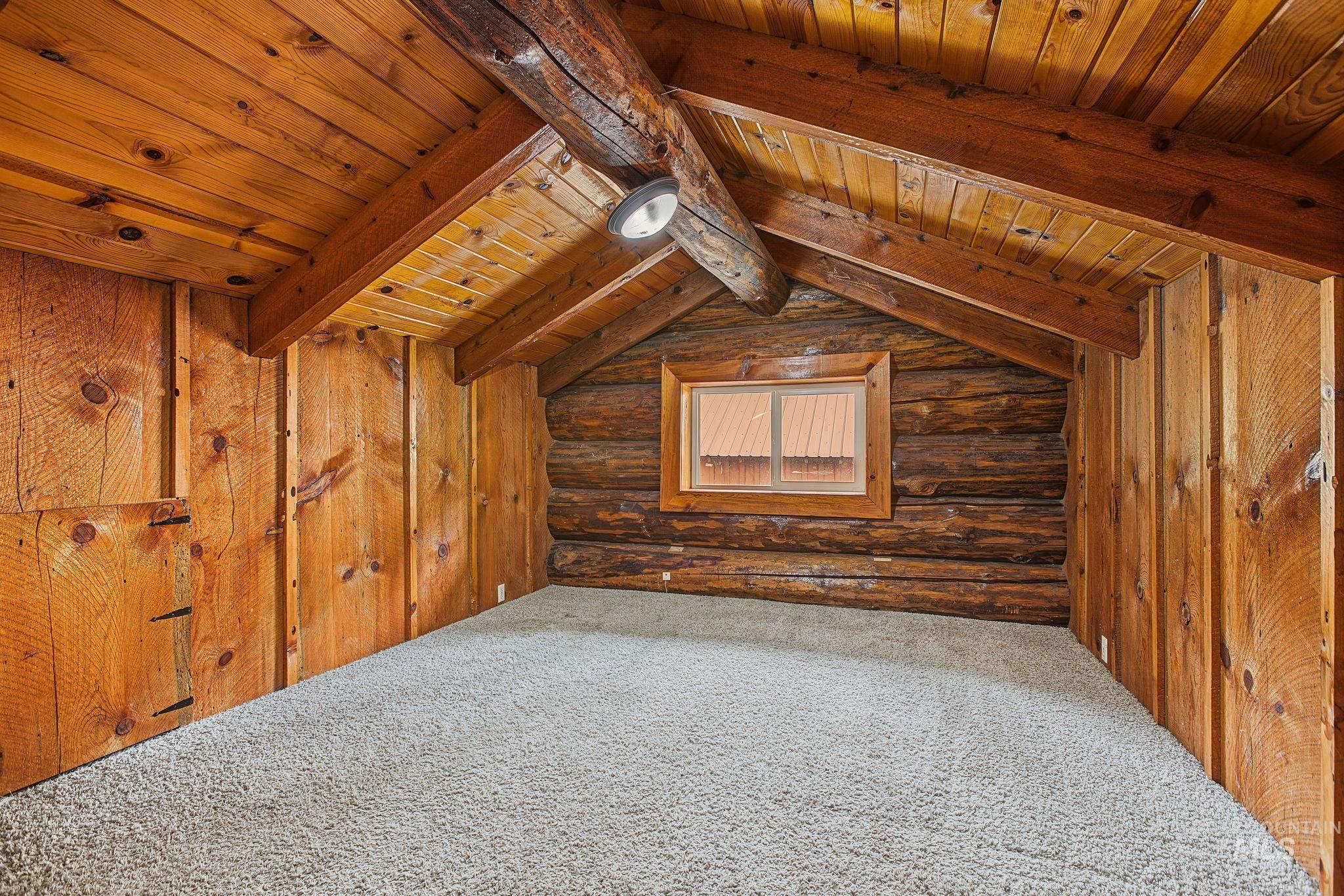 2926 Wells Bench Road Orofino, ID 83544 - Photo 31 of 48 Exposed log wall with wood-framed window