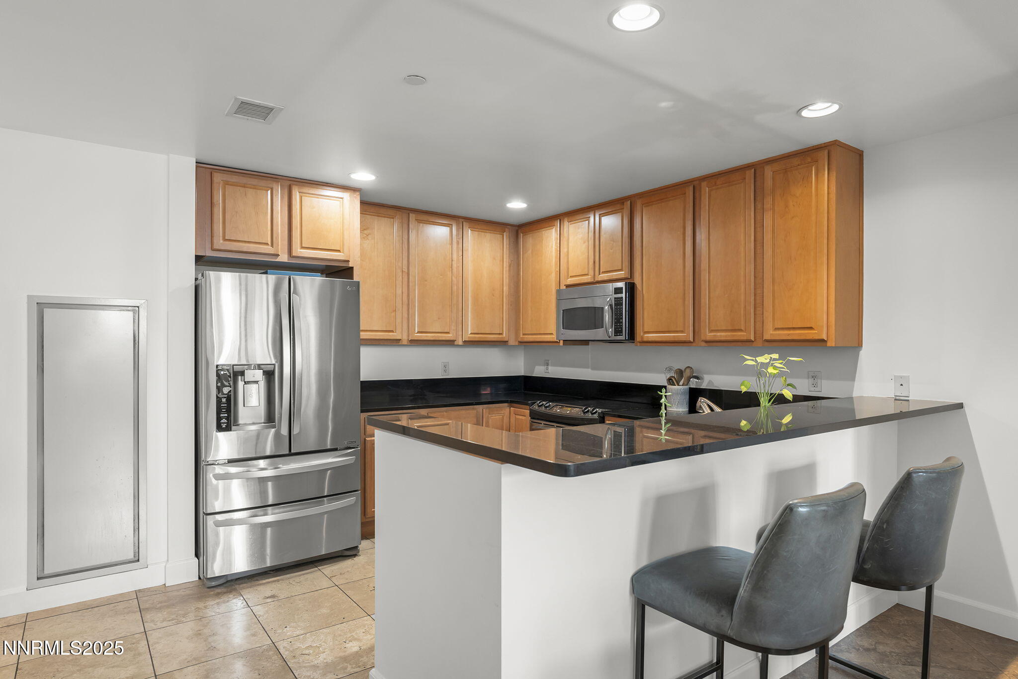 50 North Sierra Street, Unit 508 Reno, NV 89501 - Photo 13 of 27 a kitchen with stainless steel appliances granite countertop a refrigerator a sink and a stove