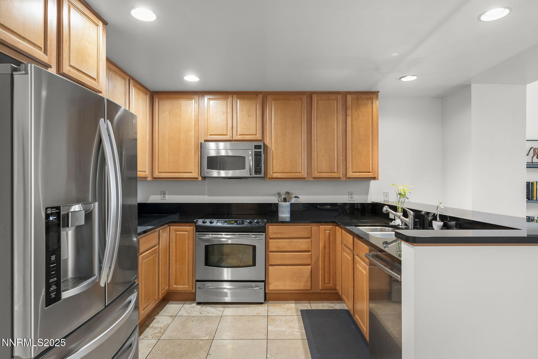 50 North Sierra Street, Unit 508 Reno, NV 89501 - Photo 14 of 27 a kitchen with a sink a refrigerator and cabinets