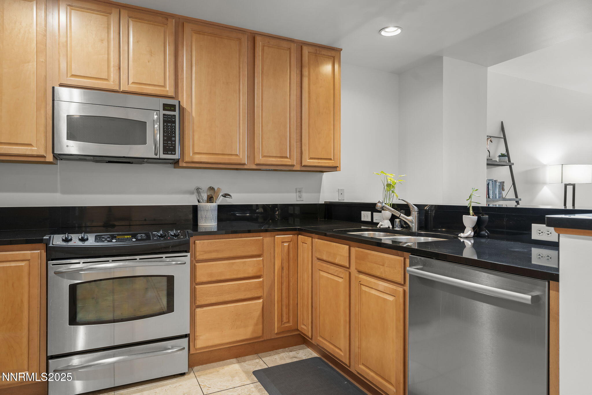 50 North Sierra Street, Unit 508 Reno, NV 89501 - Photo 15 of 27 a kitchen with stainless steel appliances granite countertop a stove microwave and sink