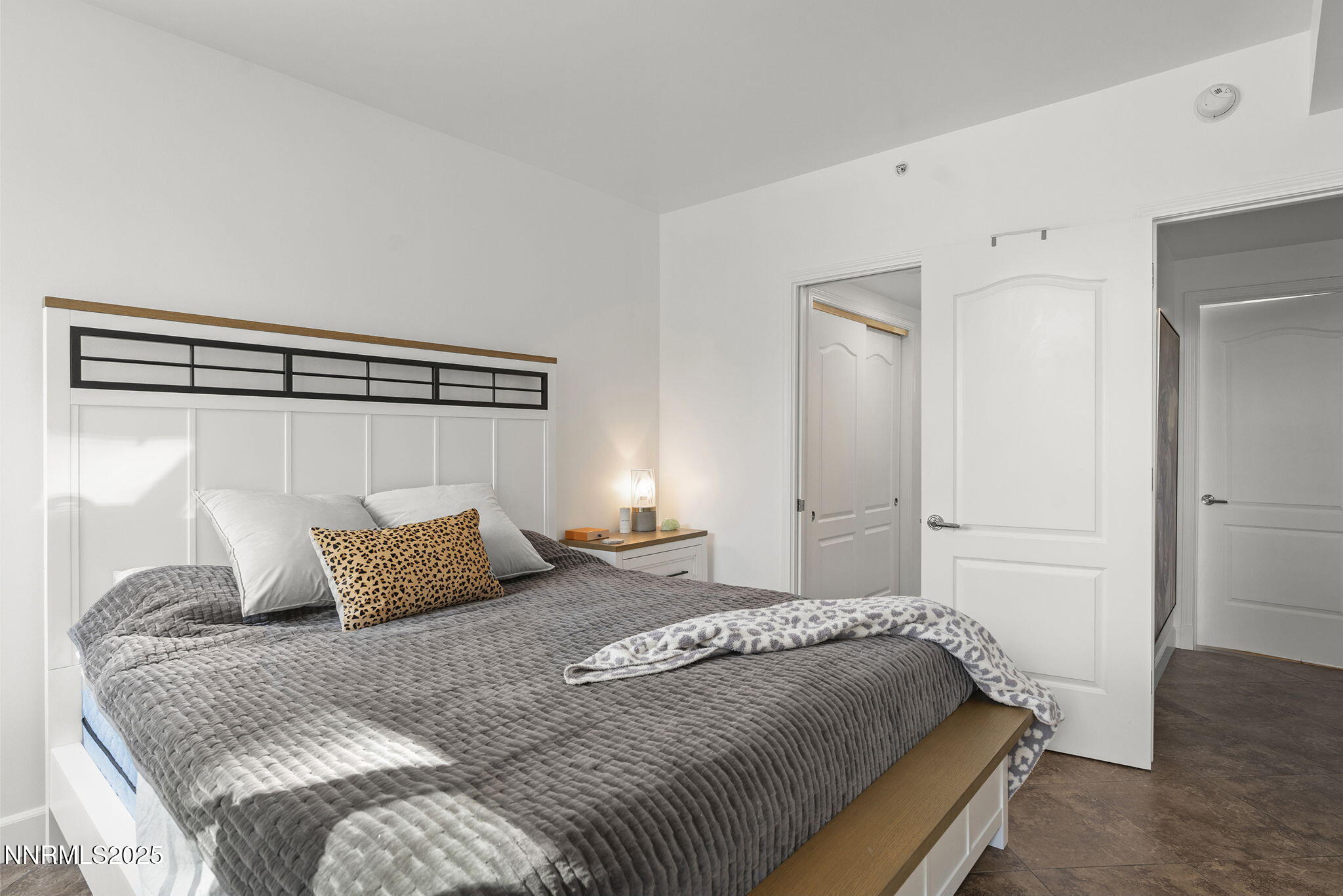 50 North Sierra Street, Unit 508 Reno, NV 89501 - Photo 17 of 27 a bedroom with a bed and wooden floor