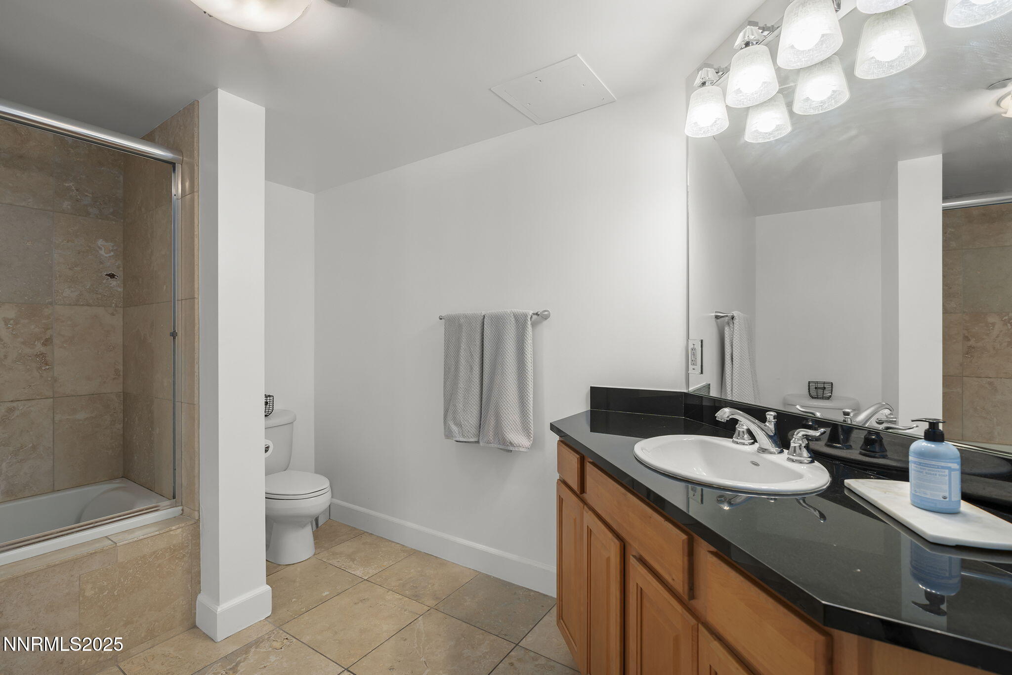 50 North Sierra Street, Unit 508 Reno, NV 89501 - Photo 18 of 27 a bathroom with a granite countertop sink a toilet and shower