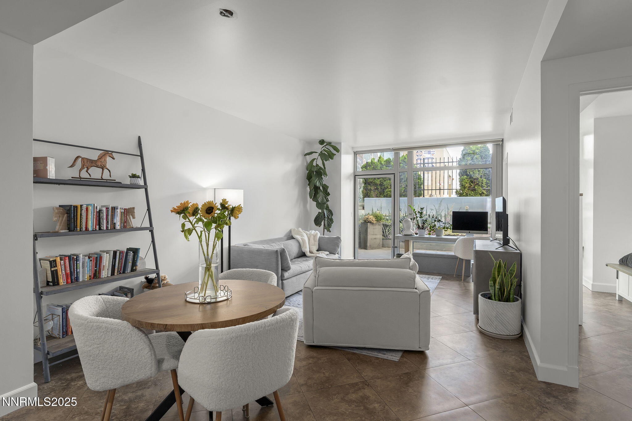 50 North Sierra Street, Unit 508 Reno, NV 89501 - Photo 5 of 27 a living room with furniture and a book shelf