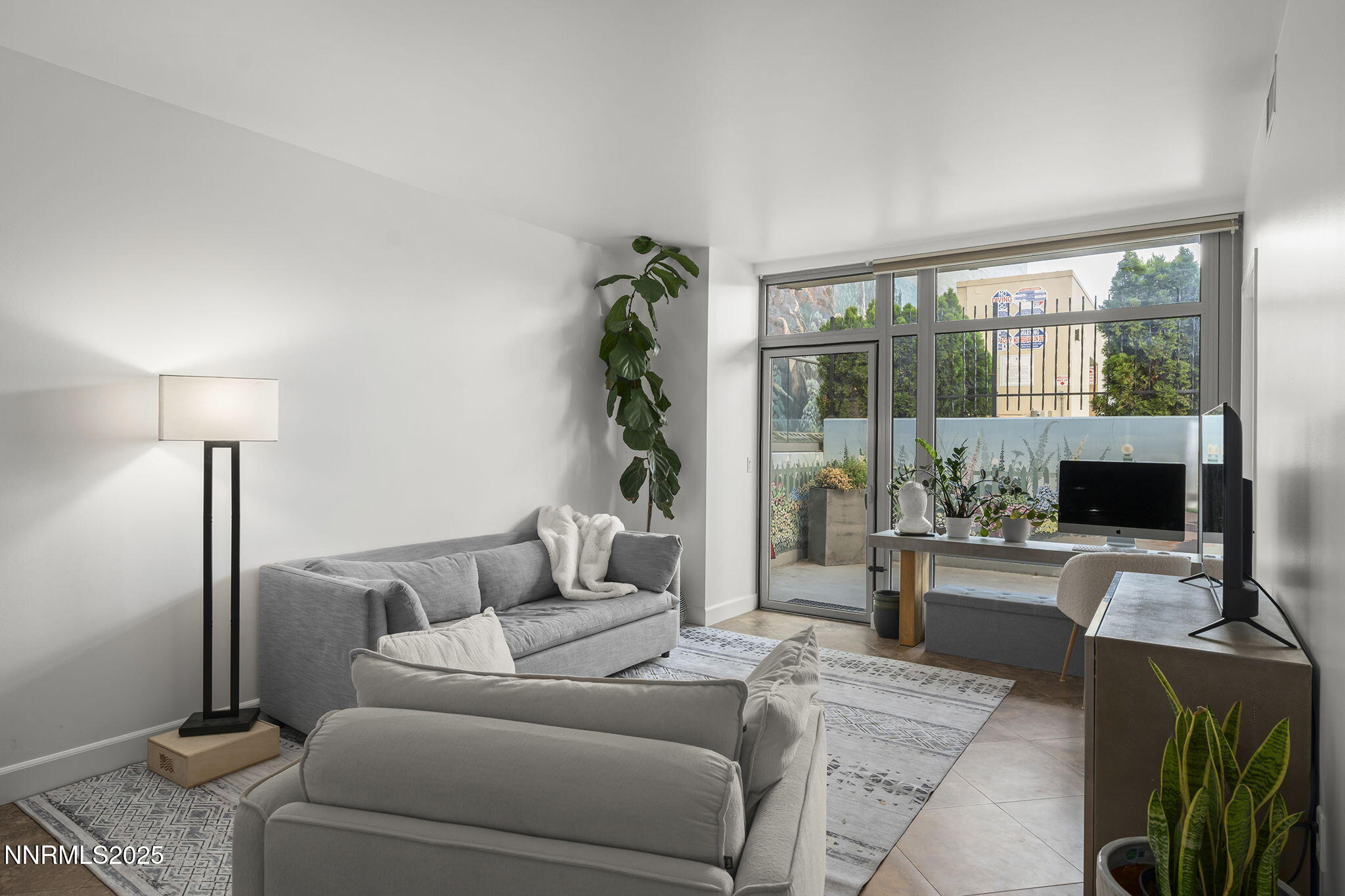 50 North Sierra Street, Unit 508 Reno, NV 89501 - Photo 6 of 27 a living room with furniture and a flat screen tv