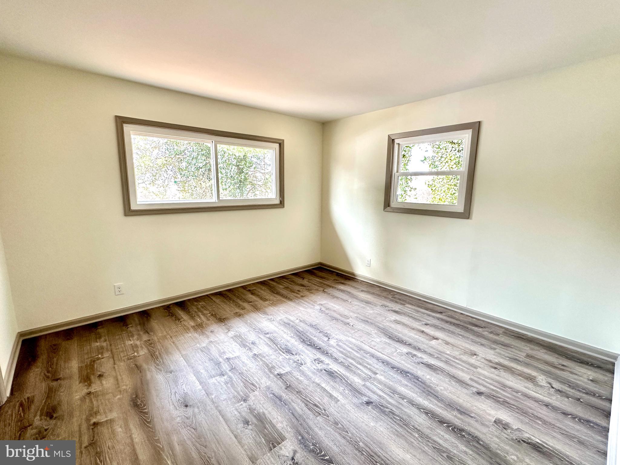 45 Smith Avenue Aberdeen, MD 21001 - Photo 8 of 9 a view of an empty room with wooden floor and a window