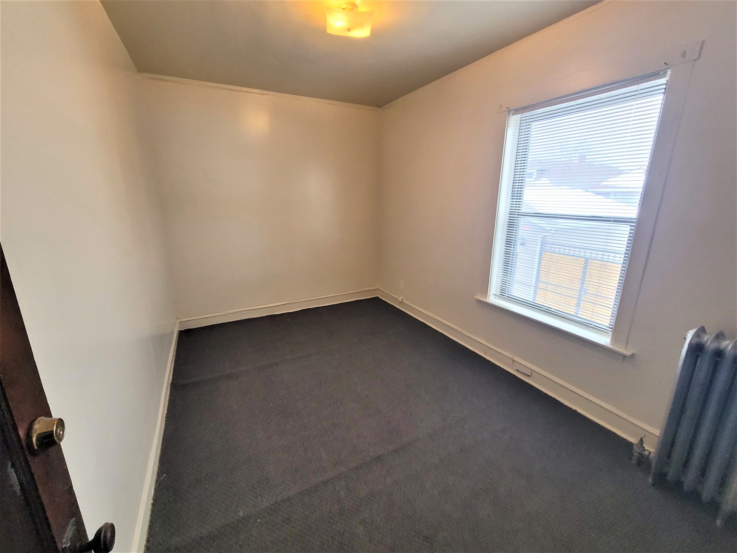 3320 West Marquette Road, Unit 2S Chicago, IL 60629 - Photo 2 of 5 an empty room with a window