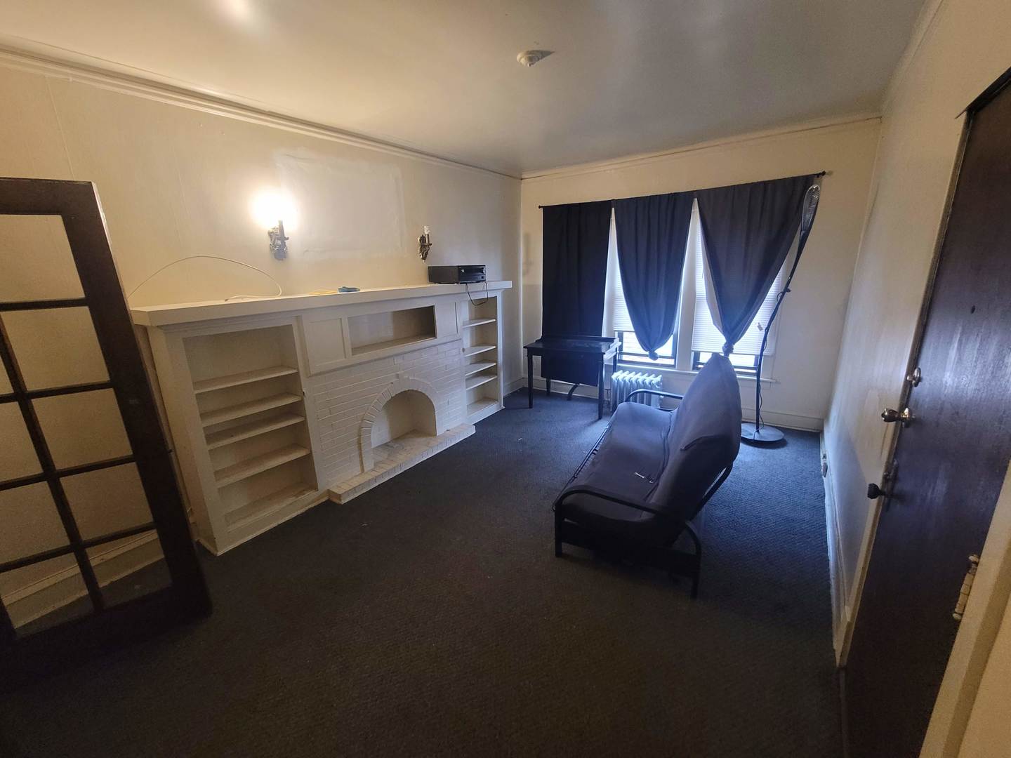 3320 West Marquette Road, Unit 2S Chicago, IL 60629 - Photo 5 of 5 a living room with furniture and a window
