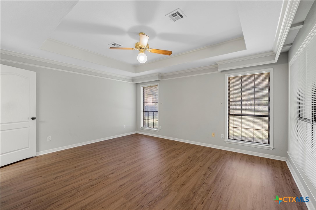 3601 Willow Bend Circle Waco, TX 76708 - Photo 17 of 37 an empty room with wooden floor and windows