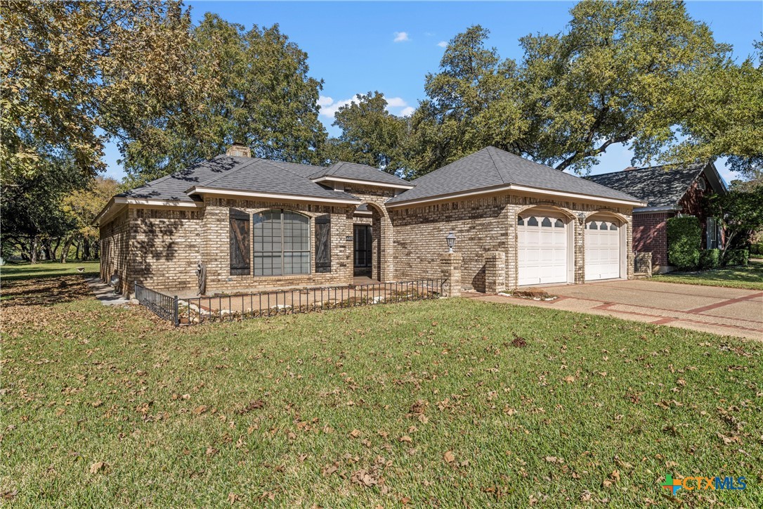 3601 Willow Bend Circle Waco, TX 76708 - Photo 2 of 37 a front view of a house with garden