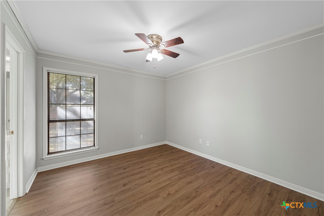 3601 Willow Bend Circle Waco, TX 76708 - Photo 23 of 37 wooden floor in an empty room with a window