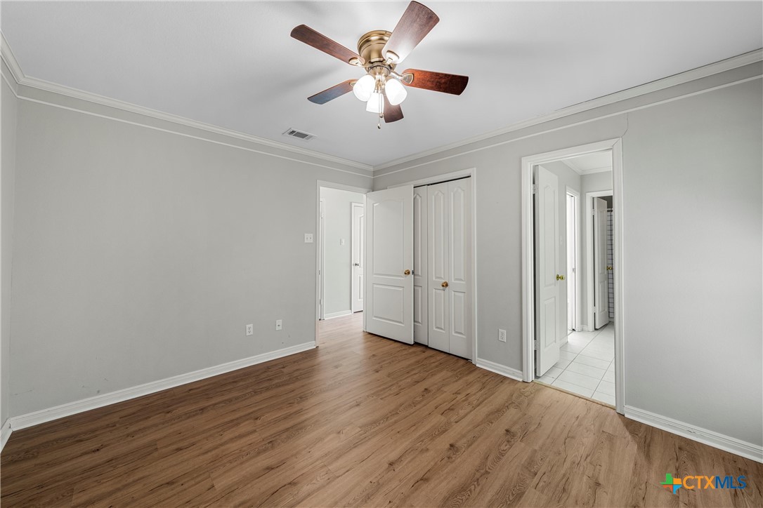 3601 Willow Bend Circle Waco, TX 76708 - Photo 24 of 37 an empty room with wooden floor and ceiling fan