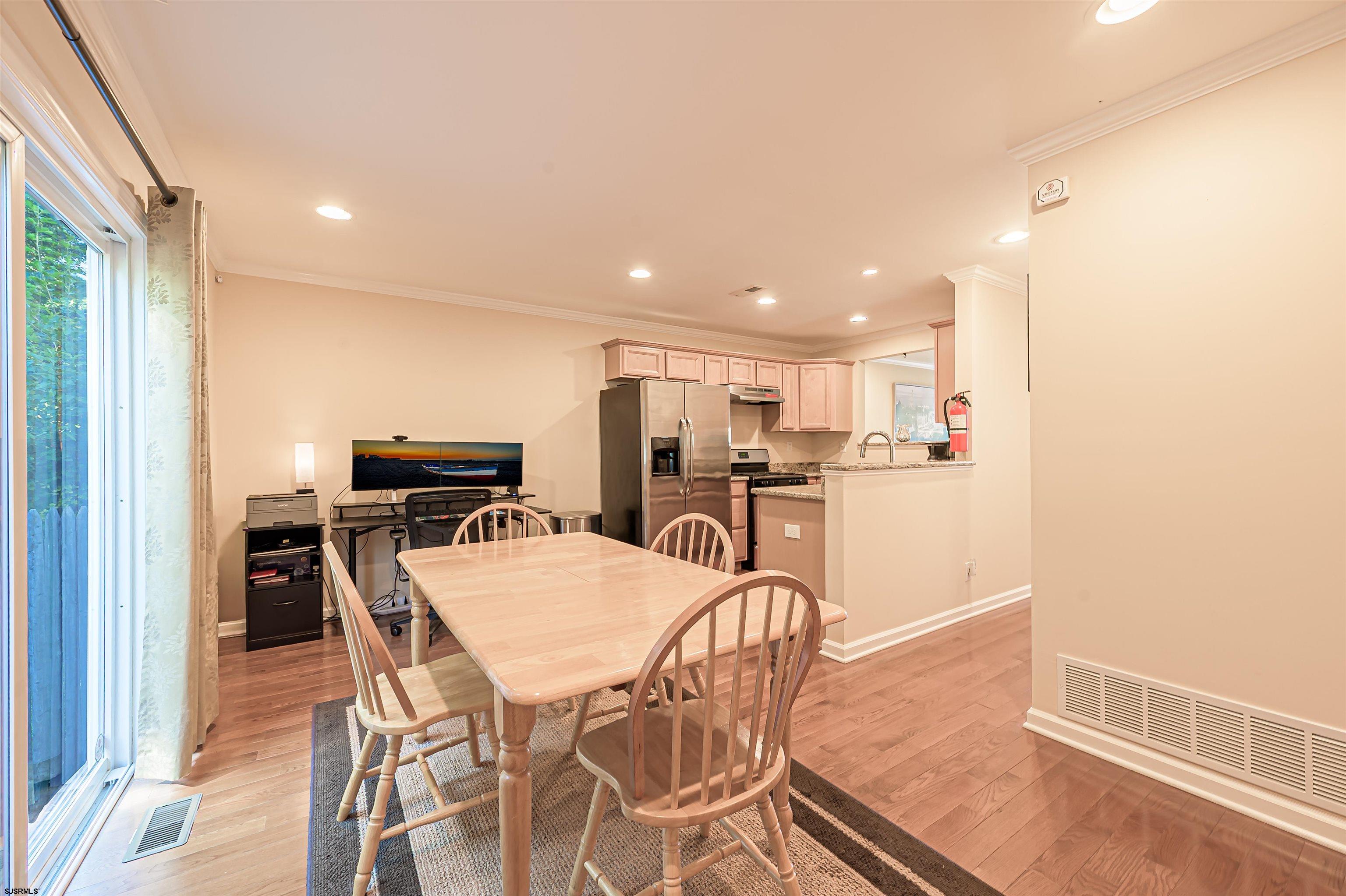 22 Millstream Road, Unit 22 Clementon, NJ 08021 - Photo 14 of 28 a kitchen with a table and chairs in it