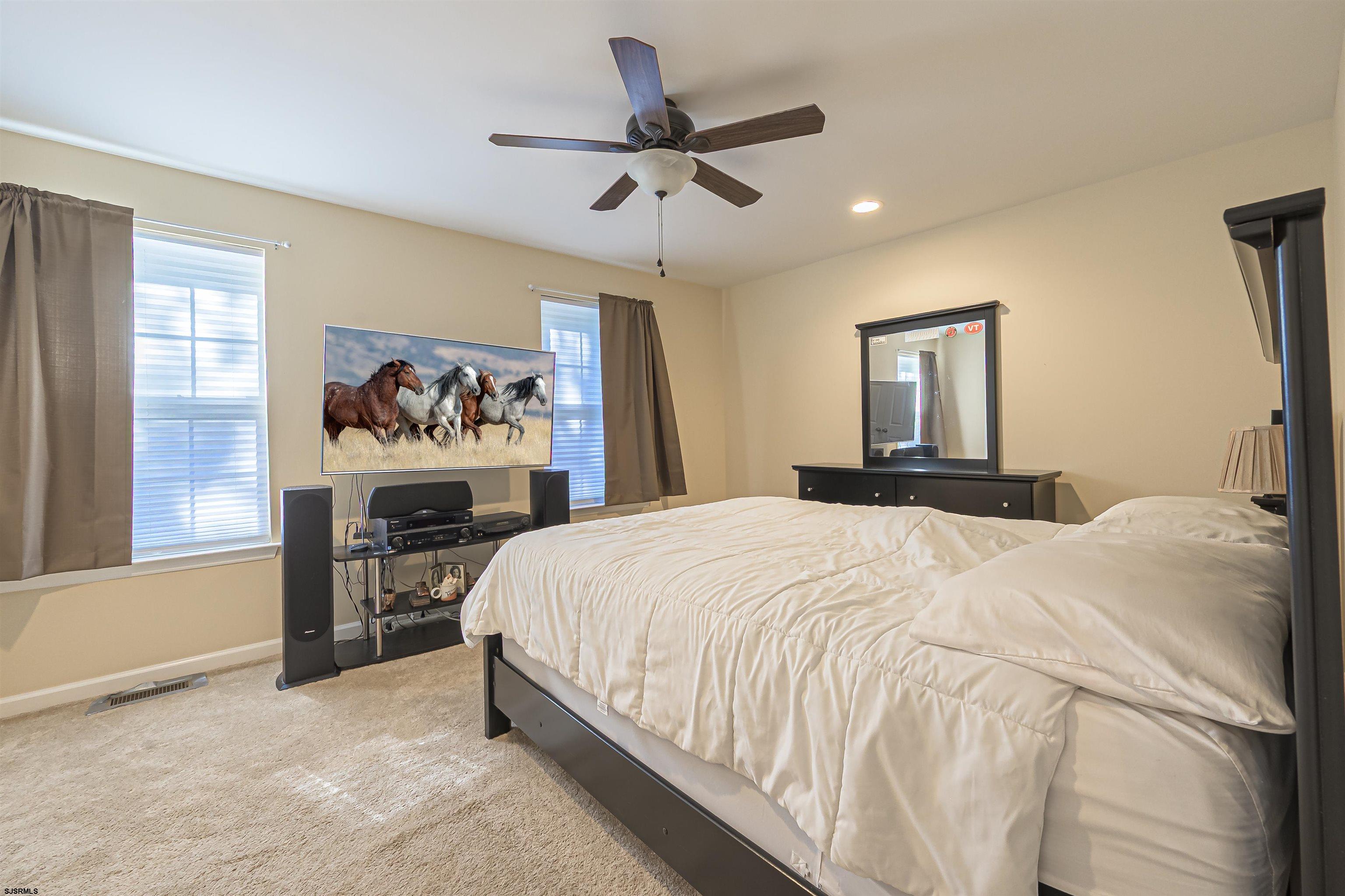 22 Millstream Road, Unit 22 Clementon, NJ 08021 - Photo 24 of 28 a bedroom with a bed and a chandelier